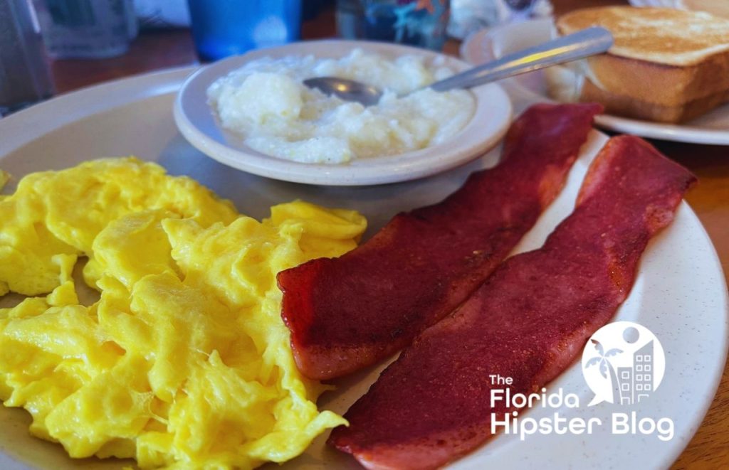 43rd Street Diner Gainesville Florida and a plate of Eggs Grits bacon and toast.  Keep reading to find out all you need to know about the best brunch in Gainesville. 