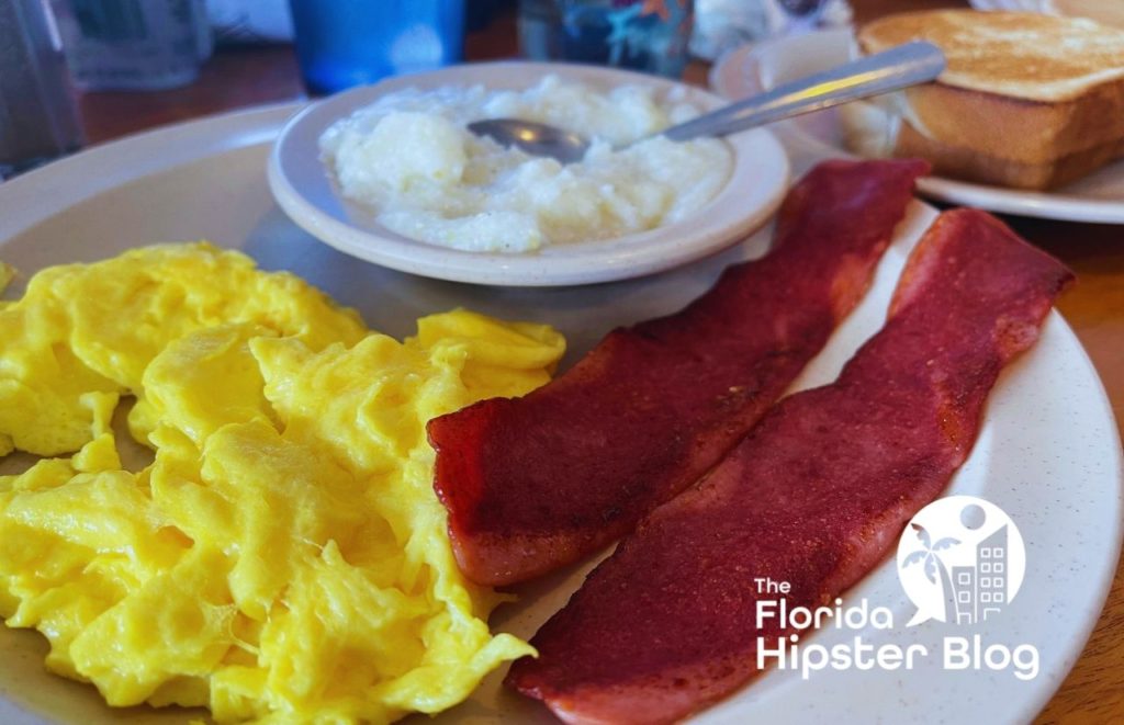 43rd Street Diner Gainesville Florida Eggs Grits bacon and toast. Keep reading to find out more about the best Gainesville breakfast places. 