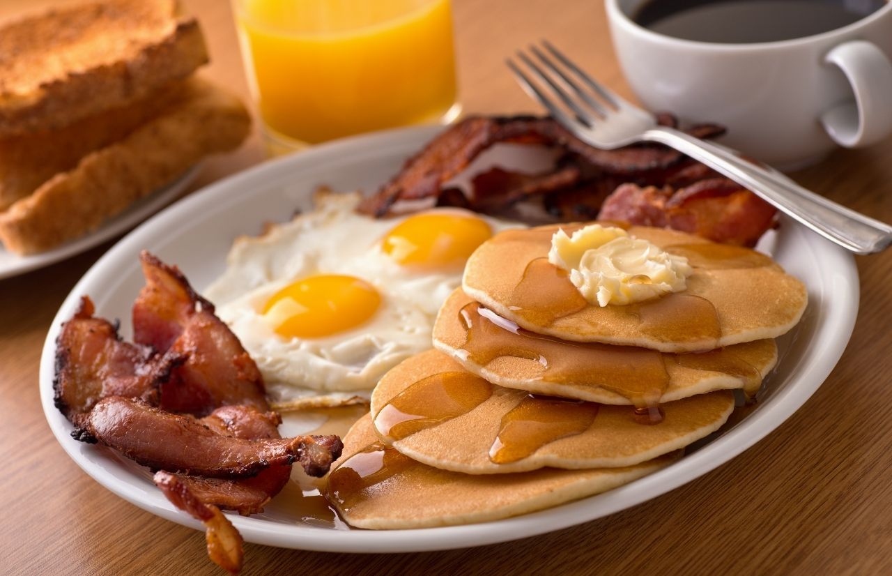 Best Breakfast in Gainesville Florida with bacon pancakes and eggs