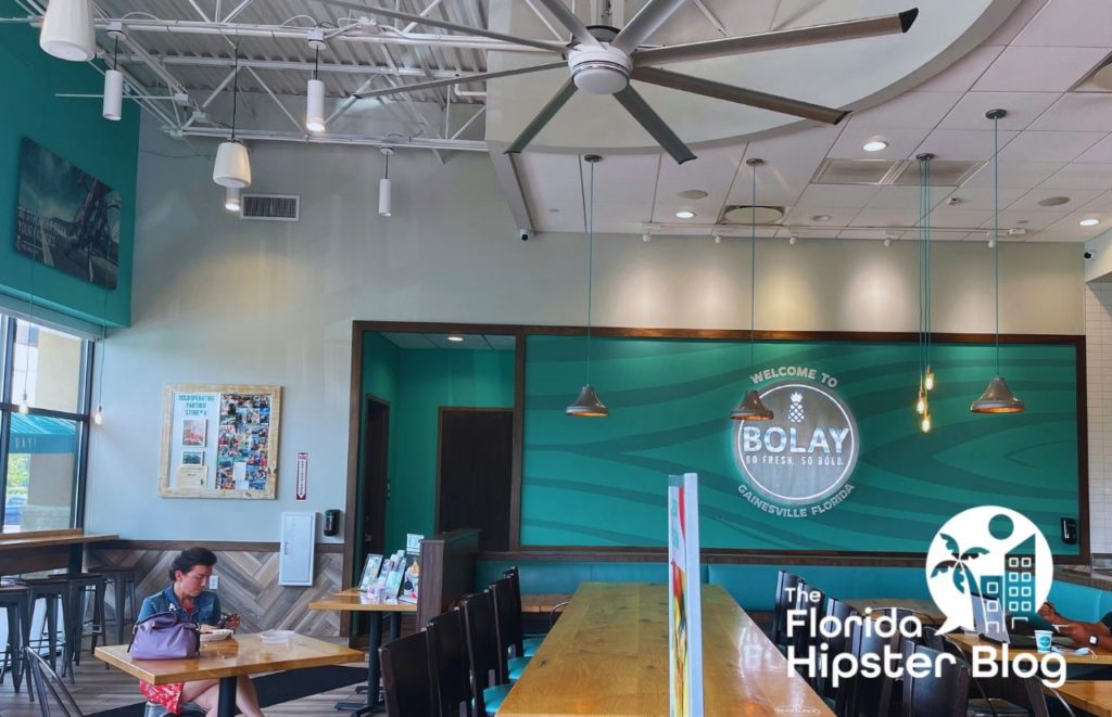 Bolay Gainesville Florida interior with large overhead fan. Keep reading to find out the best lunch in Gainesville.