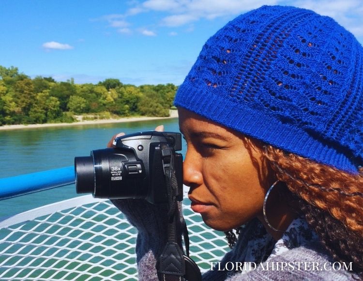 NikkyJ Using Camera at the Waterfalls. Keep reading learn about what to pack for Florida and how to create the best Florida Packing List 