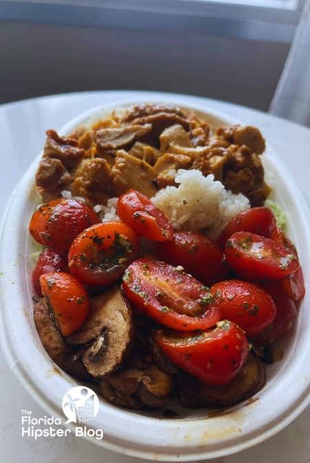 Bolay mushrooms chicken tomato and rice. Keep reading to get the best lunch in Orlando!