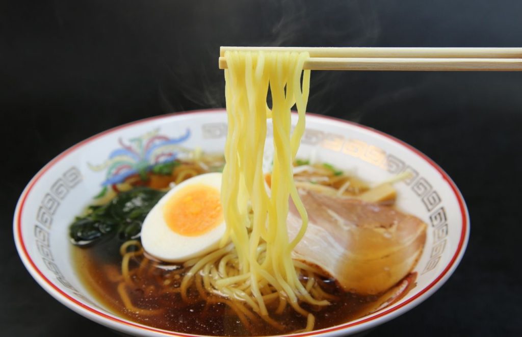 Ramen with dark broth egg and chicken at Chopstix Café at one of the best restaurants in Gainesville Florida.