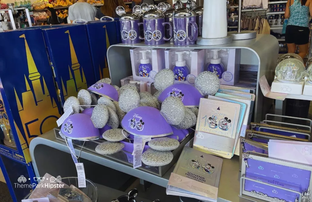 Epcot Flower and Garden Festival 2023 Disney 100th Anniversary merchandise with Mickey Ears and Cups. Keep reading to get the best souvenirs from Florida.