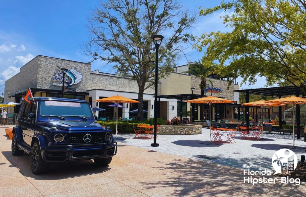 Gainesville Florida Celebration Pointe The Keys Grill and Piano Bar with Blue Mercedes G Wagon and Spurrier's Grill and Bar. Keep reading to learn more about outdoor dining in Gainesville.