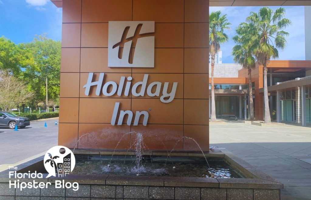Holiday Inn Disney Springs Entrance. One of the best hotels near Disney World. Keep reading to find out more about Holiday Inn Disney Springs. 