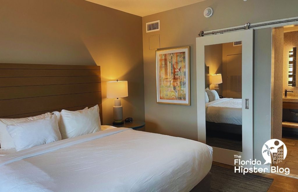  King bedroom at Hotel Indigo Gainesville Florida Celebration Pointe. Keep reading to learn more about the best Gainesville hotels.