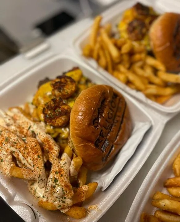 Swamp Religion Food Truck Cajun Burger with Fries. One of the best burgers in Gainesville, Florida. Keep reading to find out all you need to know about the best burger places in Gainesville, Florida.  