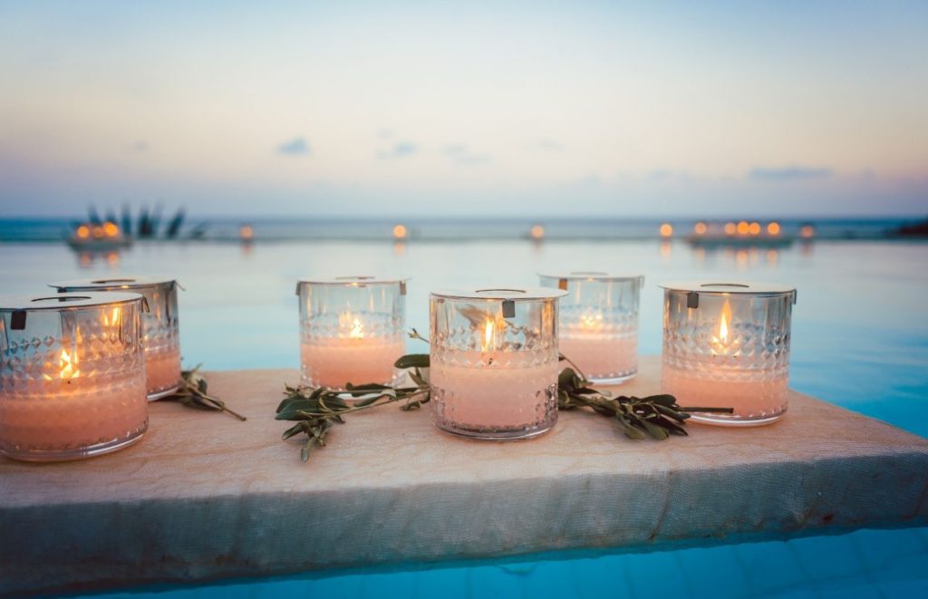 White Candles on Florida Beach. Keep reading to learn about the best Florida themed gift ideas for Christmas. 