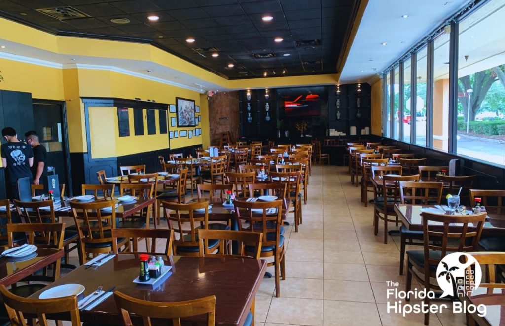 Yummy House Orlando Florida interior with brown tables and chairs. Keep reading to see what are the best places to get lunch in Orlando.