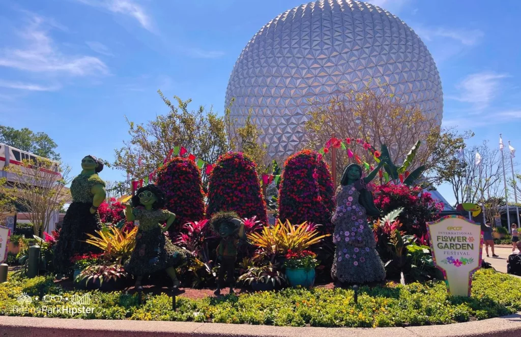 Epcot Flower and Garden Festival 2023 Encanto Topiary at the Entrance near Spaceship Earth. Keep reading to learn how to How to Get From Epcot to Hollywood Studios for your Disney vacation. 