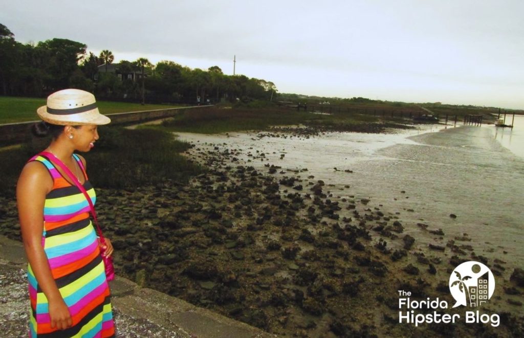 A woman explores Castillo de San Marcos in St. Augustine, Florida. Keep reading for more places to take a perfect day trip from Orlando, Florida. 