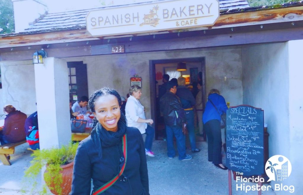 NikkyJ in front of Spanish Bakery in St Augustine Florida. Keep reading for the best things to do in St. Augustine for Christmas!