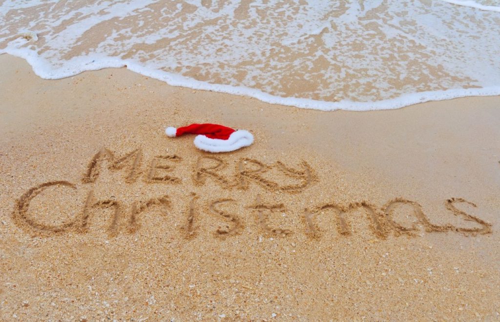 Merry Christmas on Beach Sand in Daytona Beach Florida. One of the best things to do in Orlando for Christmas.
