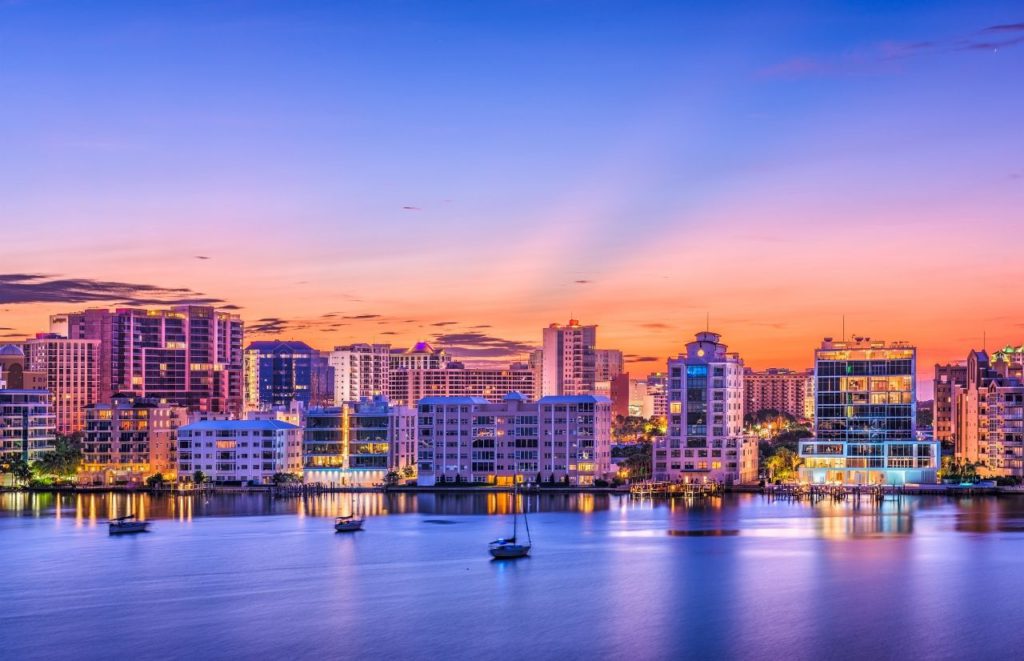 Sarasota Florida Nighttime Skyline View. Keep reading to learn about the best Florida beaches for a girl's trip!