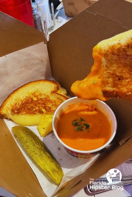 Beaches and Cream Soda Shop at Disney Beach Club Grilled Cheese Sandwich with Tomato Soup Dip. Keep reading to get the best snacks to take to Disney World.