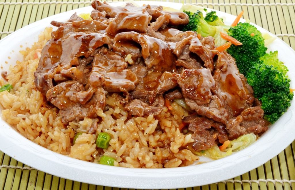 Hibachi Express dish of mixed vegetables, steak and fried rice with sauce. Keep reading to find out more about the best hibachi in Orlando.