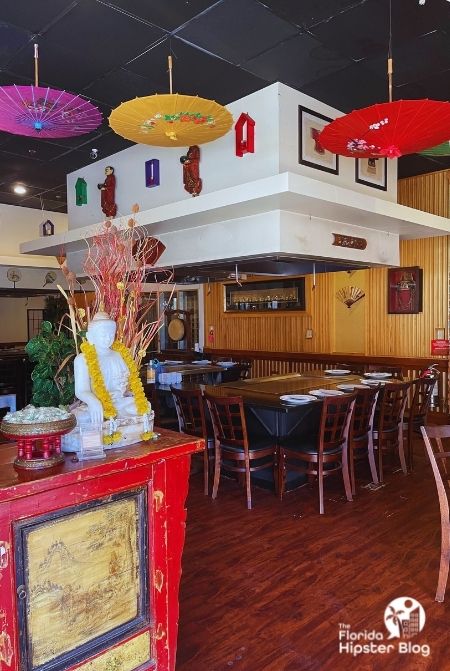 Interior of Oishi Hibachi in Orlando with large tables and Japanese décor. Keep reading to find out more about Japanese food in Orlando.