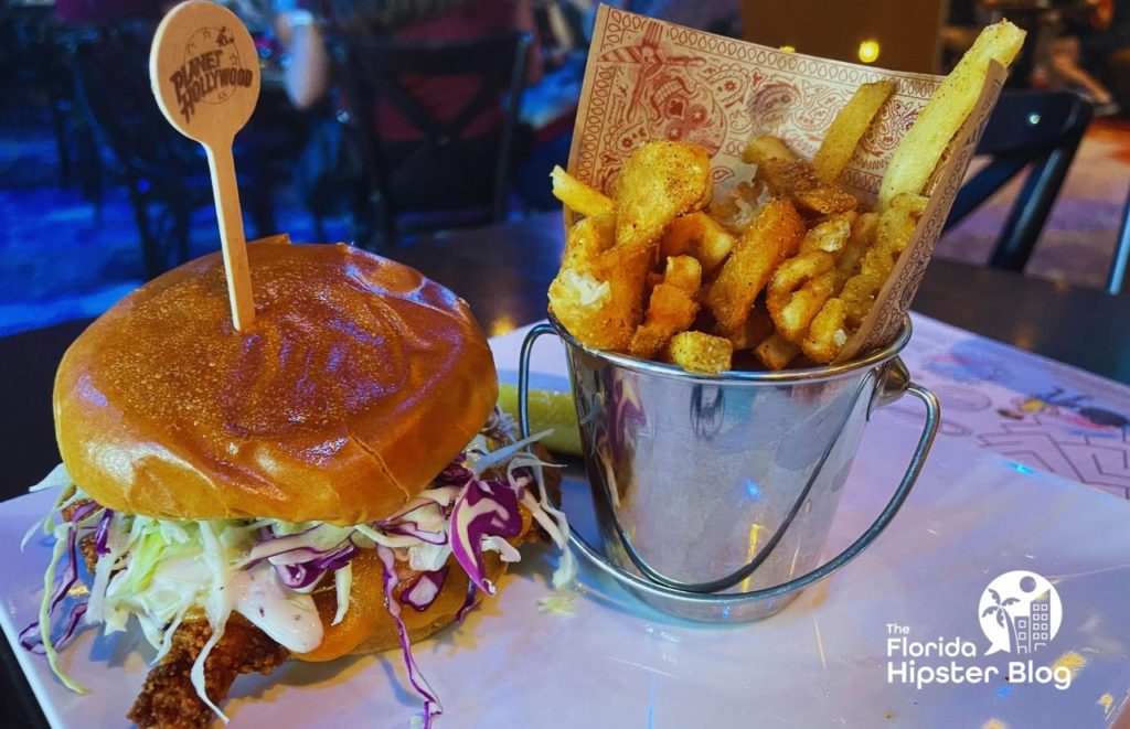 Planet Hollywood Hot Chicken Sandwich and Fries. Keep reading to learn more about kid friendly restaurants in Orlando.