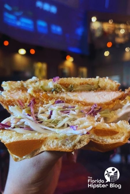 Hot Nashville Chicken Sandwich at Planet Hollywood Disney Springs Orlando Florida. Keep reading to find out more about kid friendly restaurants in Orlando.