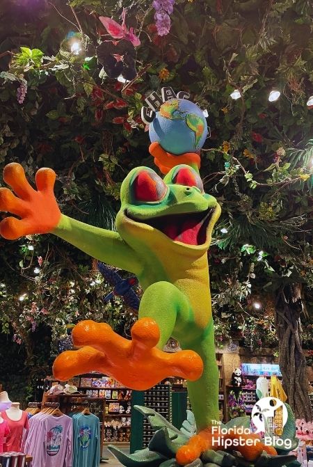 Rainforest Cafe Orlando Florida frog with merchandise. Keep reading to learn more about the best kid restaurants in Orlando. 