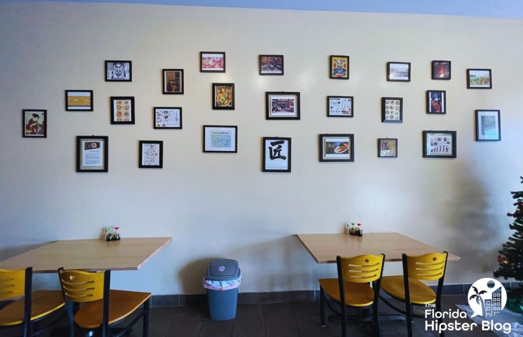 Japanese Artwork Wall at Takumi Sushi and Ramen in Orlando Florida. Keep reading to find out more about Japanese food in Orlando.