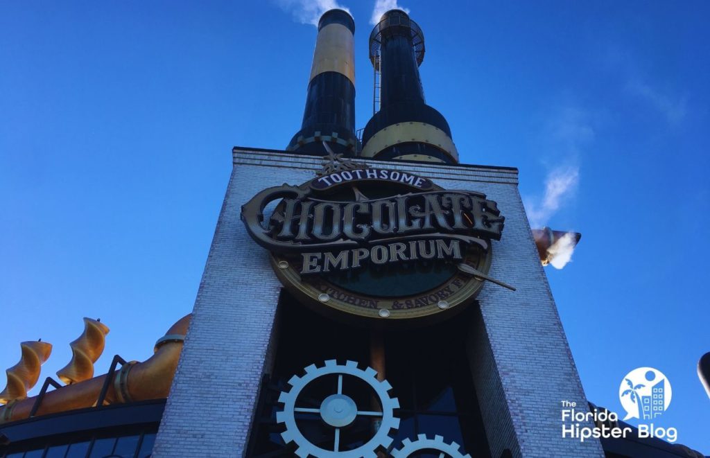 Toothsome Chocolate Emporium outside entrance in steampunk design. Keep reading to learn more about kid friendly restaurants in Orlando.