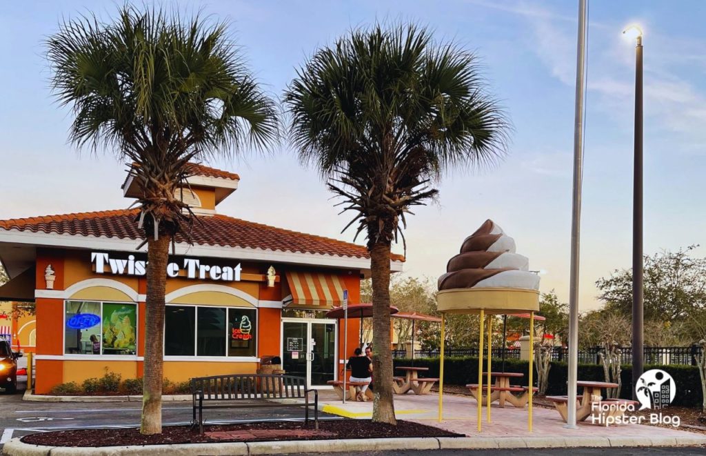 Twistee Treat Lake Buena Vista entrance with a twisted swirl cone statue in front. Keep reading to find out about the best ice cream in Orlando.