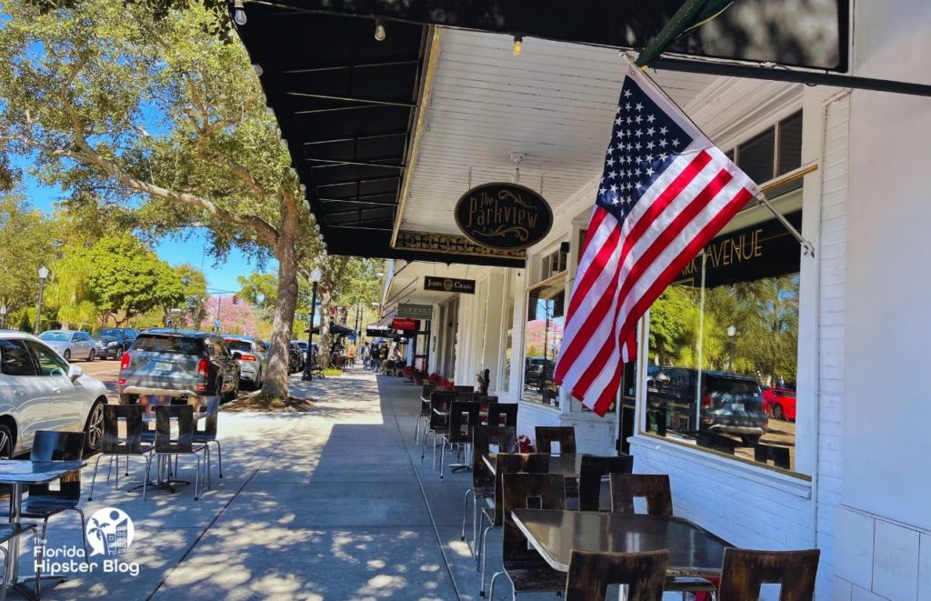 Winter Park Florida The Parkview outdoor seating tucked in under a covered roof for shade. Keep reading to find out more about brunch in Winter Park.