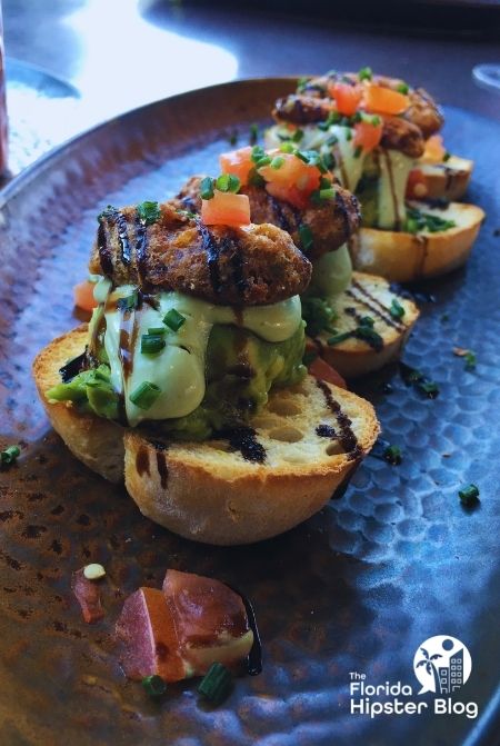 Toast with Avocado on top at Toothsome Chocolate Emporium at Universal Orlando.  Keep reading to discover more about the best kid restaurants in Orlando. 