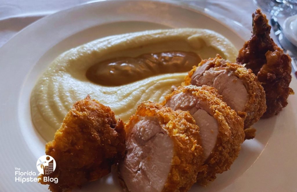 Bull and Bear fried chicken with mashed potatoes. Keep reading to learn more about the Epicurious progressive dinner in Orlando.