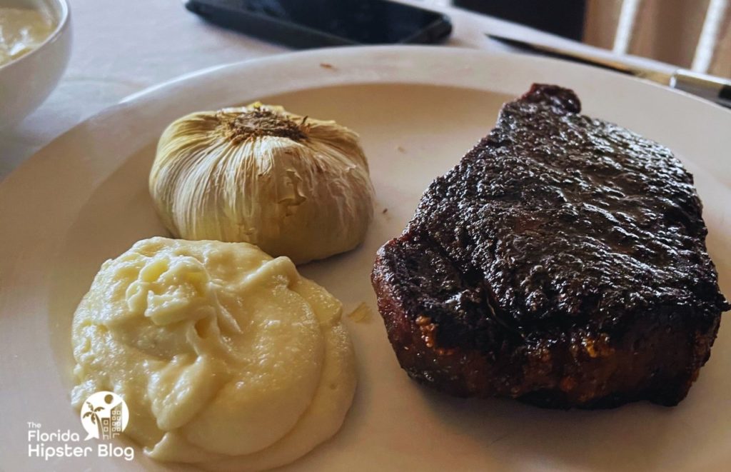 Bull an bear Steak and Mashed Potatoes. Keep reading to learn more about where to go for the best steak in Orlando.