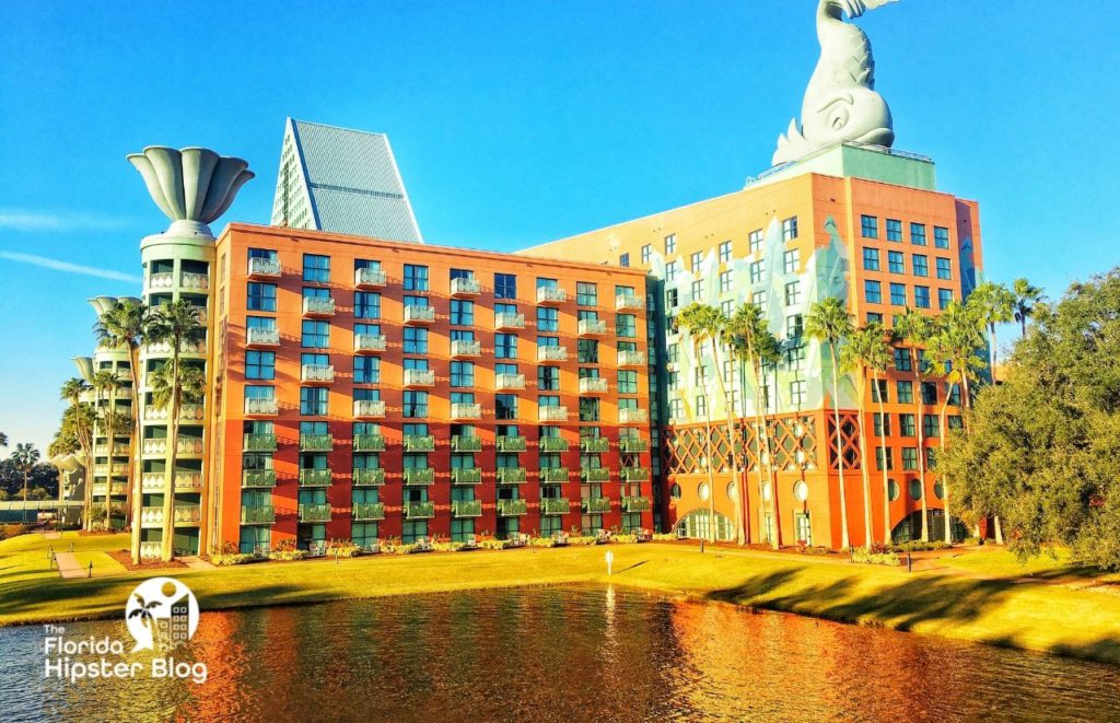 Exterior view of Dolphin Resort Walt Disney World in Orlando Florida  at the water. Keep reading for more romantic getaways in Orlando.