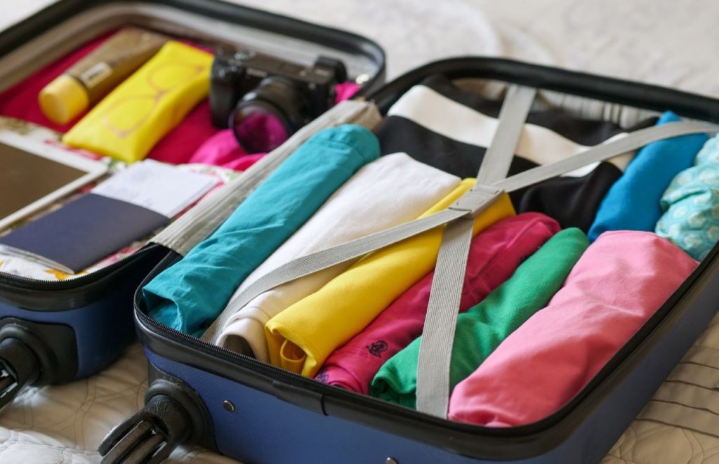 Folding clothes inside suitcase