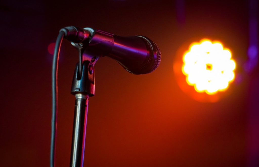 Improv Orlando stage with microphone and shining light. Keep reading to find out more about things to do in Orlando tonight.