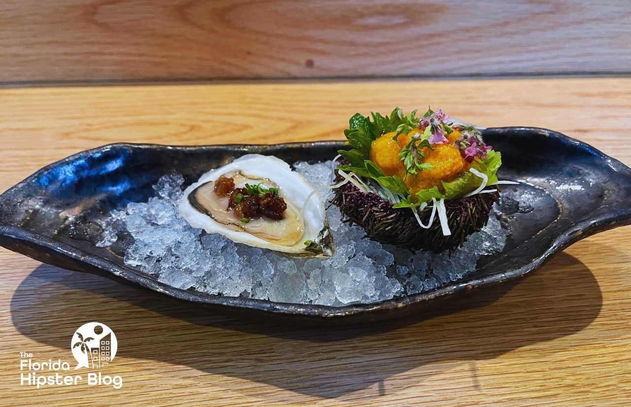 Kadence Sushi in Orlando Oyster topped with Waygu Beef Fat next to Uni in a Nest Best things to do in Orlando for a date.