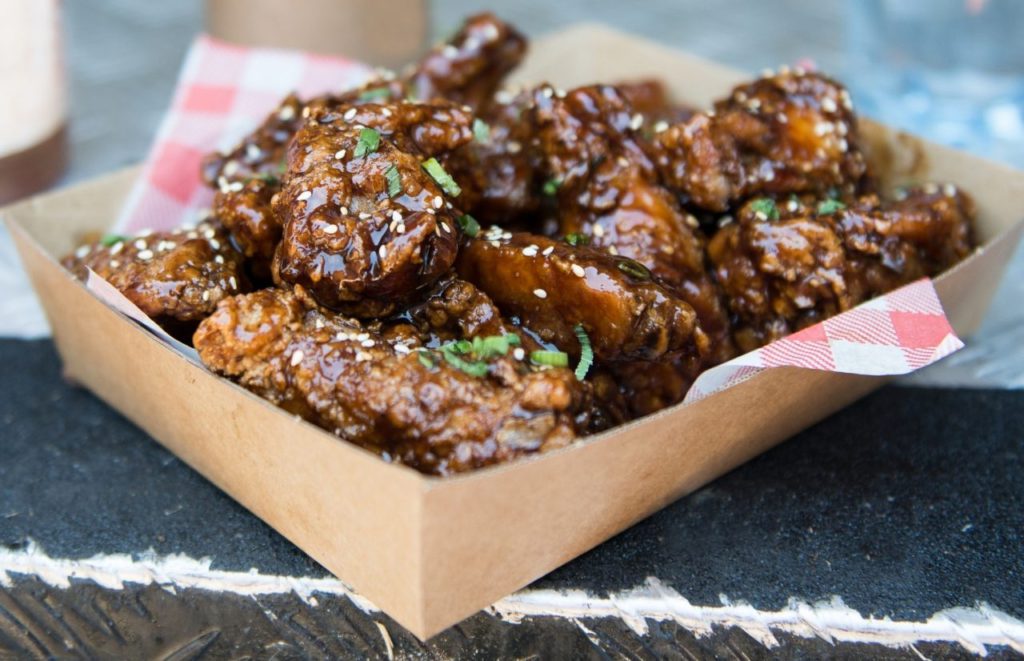 Korean Fried chicken wings smothered in sauce.  Keep reading to get the best wings in Orlando, Florida.