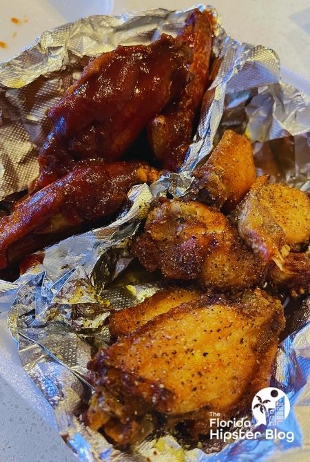 O’Town Burger and Wings Lemon Pepper and BBQ Wings in Orlando Florida. Keep reading to get the best wings in Orlando, Florida.