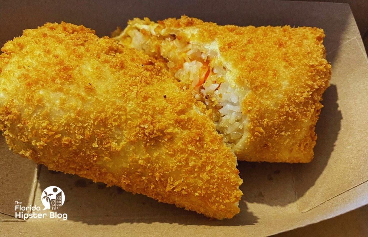 Sus Hi Eatstation deep-fried sushi burrito in Orlando Florida. Keep reading to see what are the best places to get lunch in Orlando.