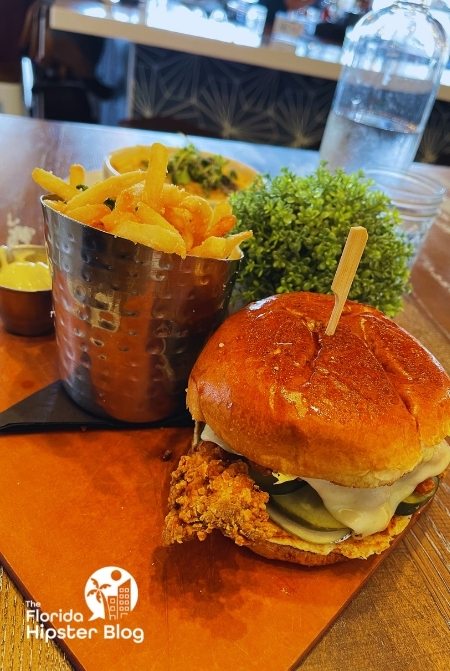 The Hot Chicken Sandwich at The Hampton Social in Orlando, Florida. Keep reading for more on the best restaurants in Orlando, Florida. 