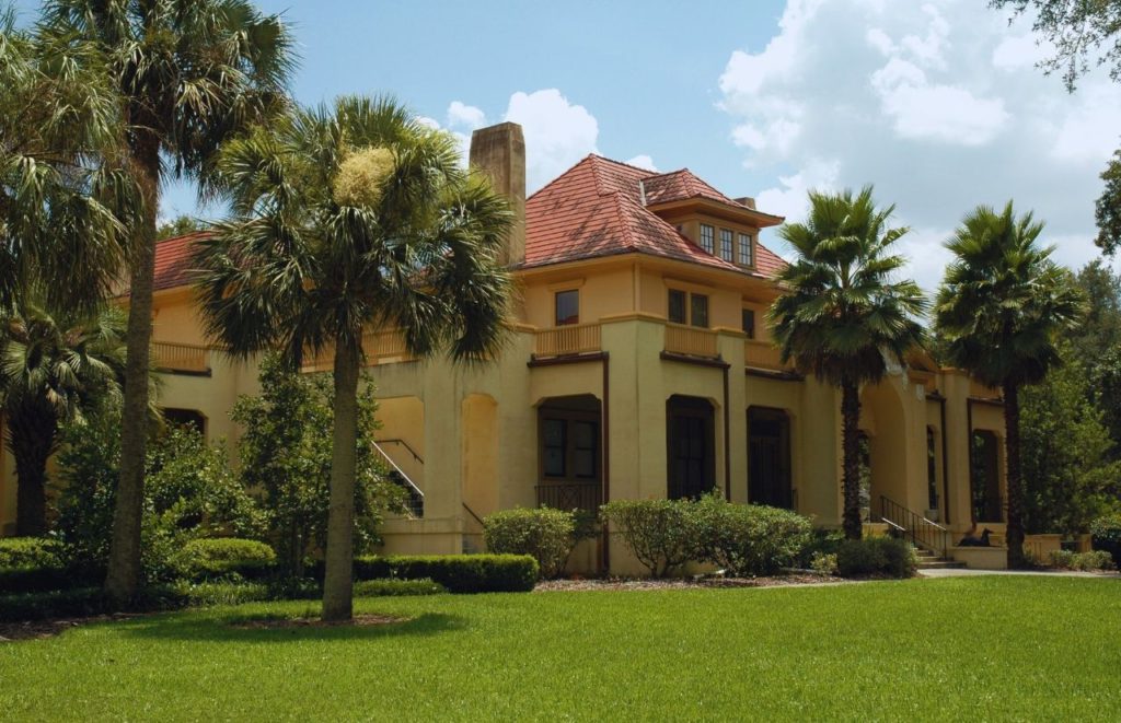 Thomas Center in Gainesville Florida exterior with tall plams. Keep reading to uncover the best things to do in Gainesville Florida.