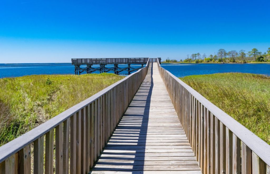 Cedar Key Florida Boardwalk. Keep reading to get the best beaches near Gainesville, Florida.
