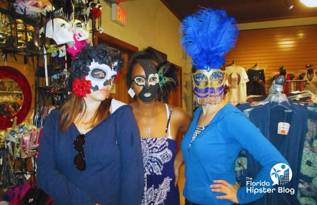 Downtown St Augustine Florida with Friends in a mask store. Keep reading for the full guide to the best Florida beaches for girl's trip. 