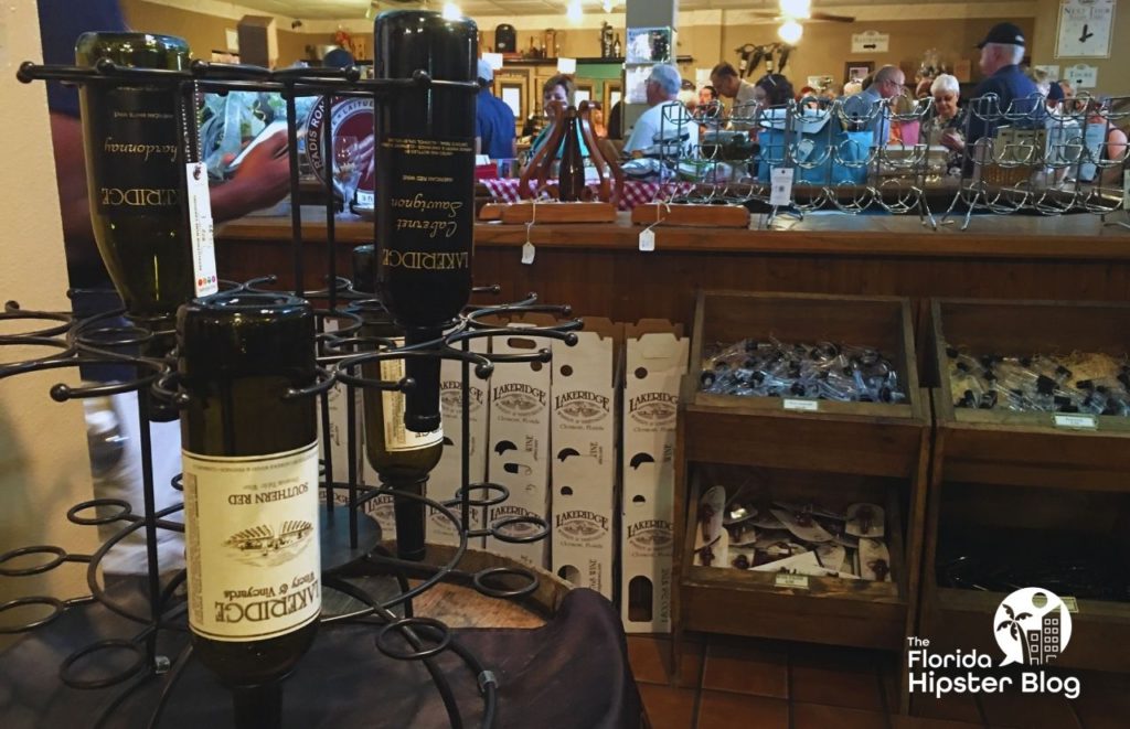 Lakeridge Winery Clermont Florida merchandise and wine. Keep reading to learn more about Florida’s largest winery. 