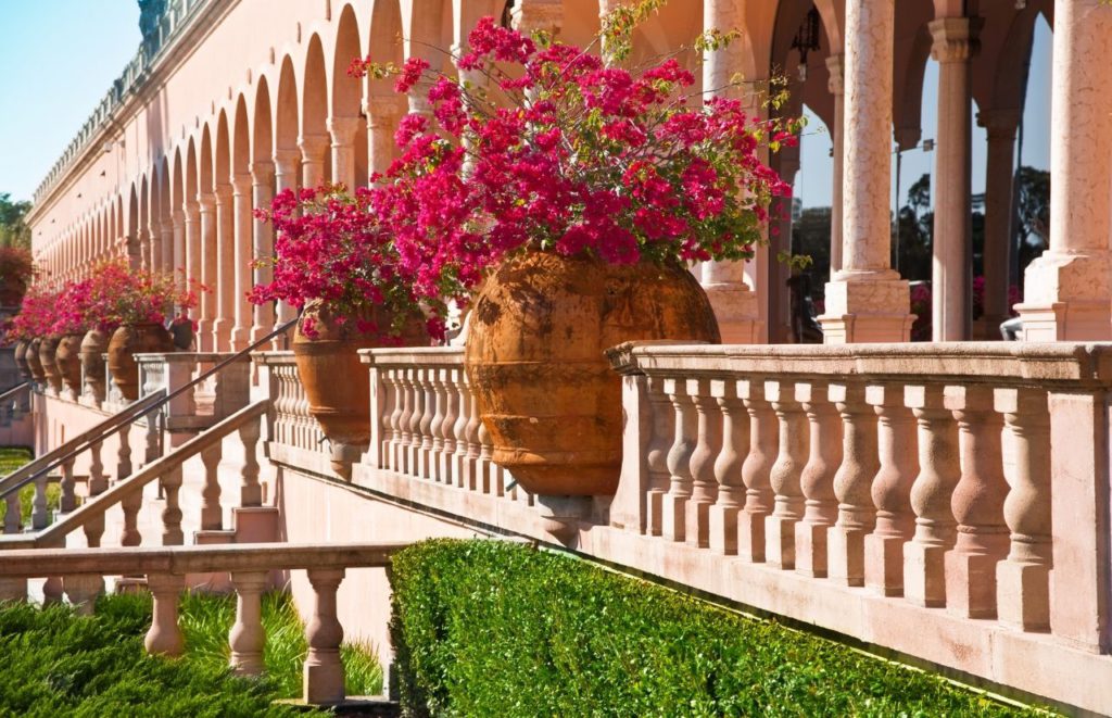 Ringling Museum Sarasota Florida with beautiful foliage in grand planters. Keep reading to find out all you need to know for your next day trip from Gainesville.
