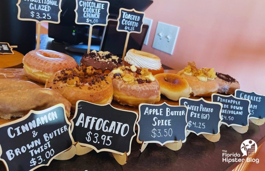 The Salty Dog Donut Shop in Orlando Florida Affogato Sweet Potato Pie and Pineapple Upside Down Cake Donuts. Keep reading to get the best 1 day Orlando itinerary and the best things to do in Orlando besides theme parks.