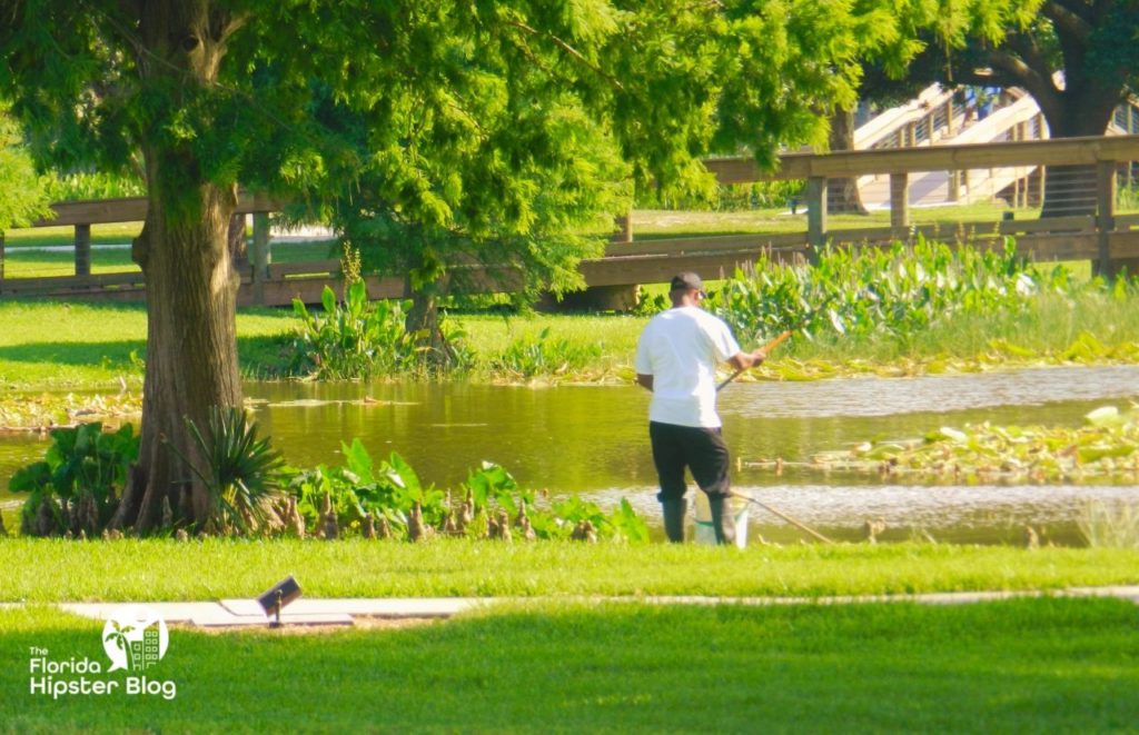 Venetian Gardens in Leesburg, Florida Black Man fishing in the Lake. Keep reading to get the best days trips from The Villages, Florida.