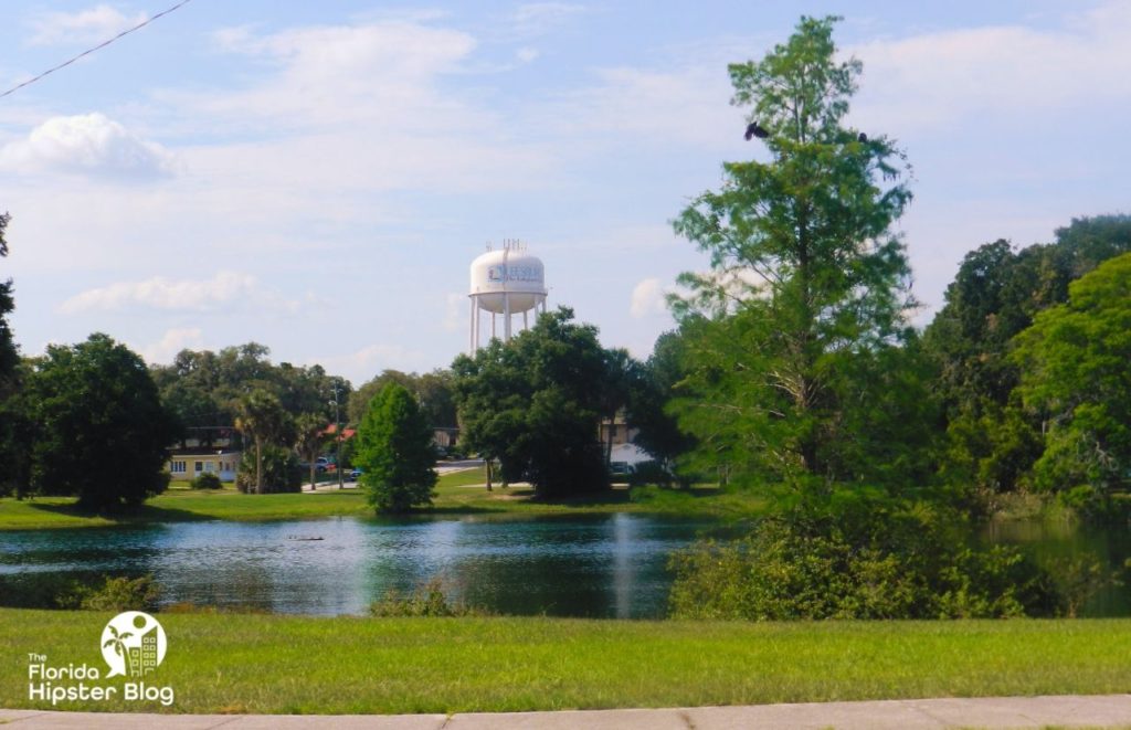 Welcome to Leesburg, Florida Water Tower over Pond. Keep reading to get the best days trips from The Villages, Florida.