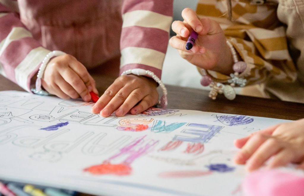 Kids coloring Happy Easter at Crayola Experience in Orlando Florida
