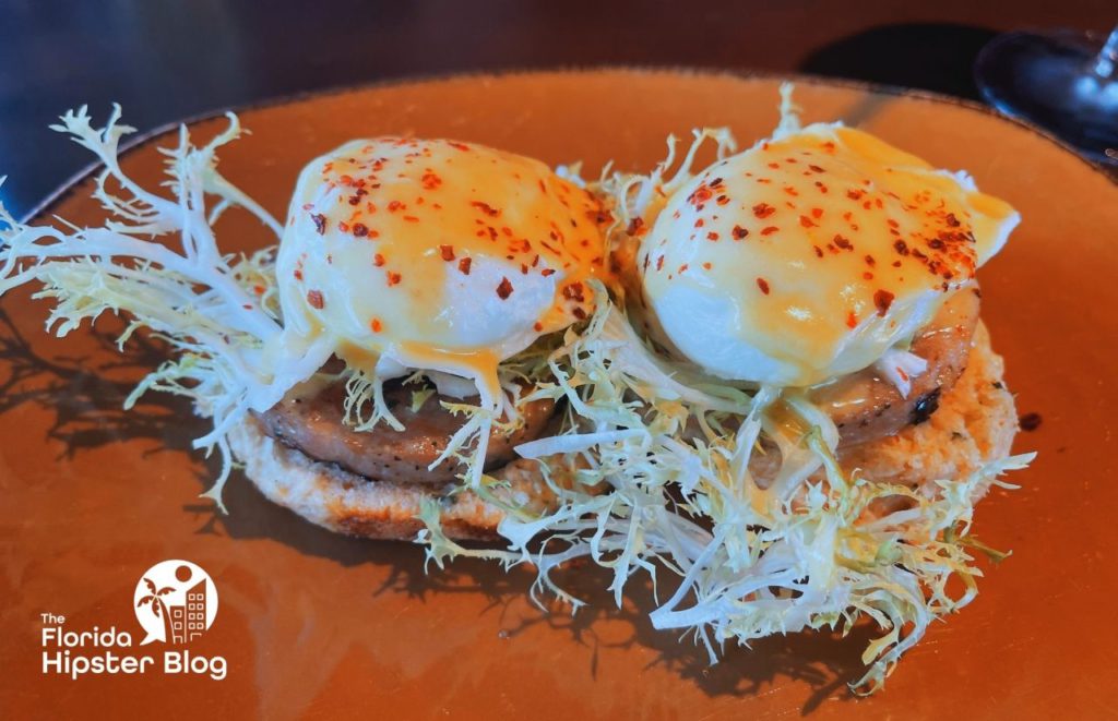 Chicken Benedict at Wine Bar George in Disney Springs in Orlando, Florida. Keep reading for more on the best restaurants in Orlando, Florida. 
